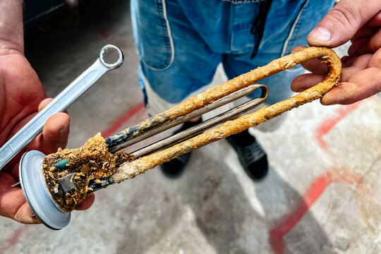 Heating element of the water heater with rust and scale.