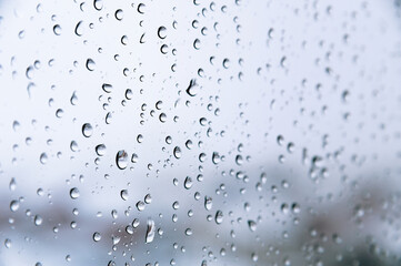 Naklejka na ściany i meble Rain drops on window glasses texture background