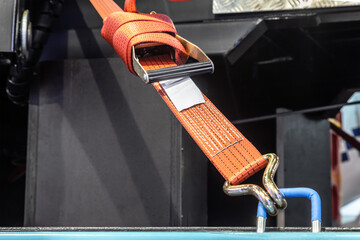 cargo is held by tension safety belts with mechanical locks