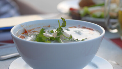 Coconut soup with seafood. Close up thai soup
