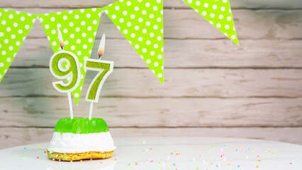  Beautiful festive background with the number  97 with a cake and lit candles, space saving for any...
