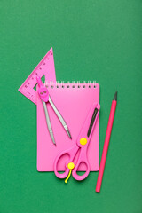 School stationery on green background