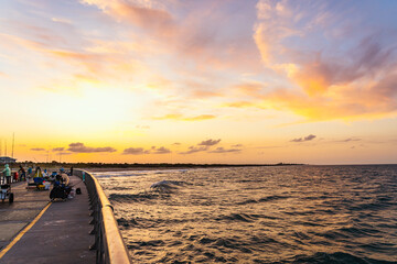 Sunset at the fishing pier. Sebastian Inlet Fishing Pier in Florida at night
