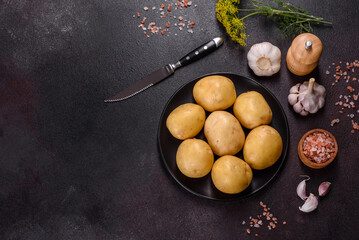 A pile of young potatoes on the table. The benefits of vegetables
