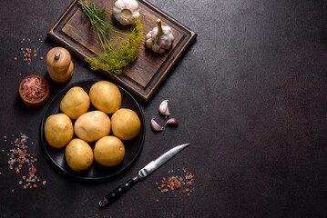 A pile of young potatoes on the table. The benefits of vegetables