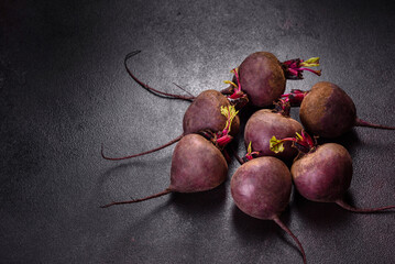 A pile of raw beets on the table. The benefits of vegetables