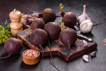 A pile of raw beets on the table. The benefits of vegetables