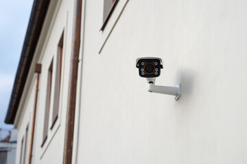 Modern smart outdoor cctv camera on house, protecting property against burglars and robbers