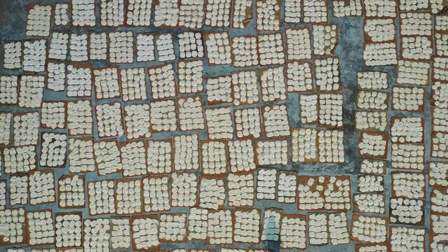 Aerial view of Women at work on the preparation of natural fabric, Barga, Rajshahi, Bangladesh.