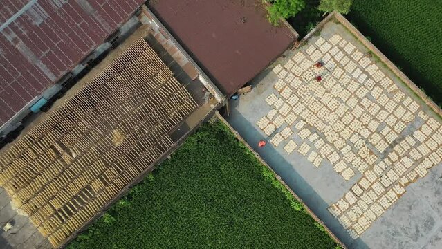 Aerial view of Women at work on the preparation of natural fabric, Barga, Rajshahi, Bangladesh.