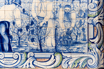 panels of azulejos, tiles, showing the grape harvest in the vineyards at the railway station of Peso da Regua, Portugal