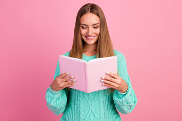 Photo of cheerful gorgeous lady hold read book toothy smile isolated on pastel pink color background