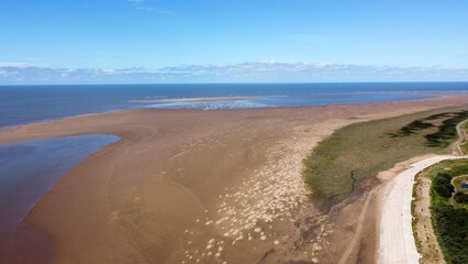Aerial view of a beach at low tide with the ocean in the distance. Taken in Lytham St Annes Lancashire England. 