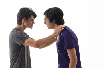 Portrait of two teenage boys fighting against pain background