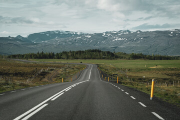 driving on an empty street with icelandic landscape