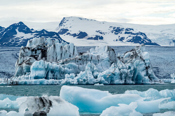 iceberg and floating blocks of ice in glacier lagoon - 514414058