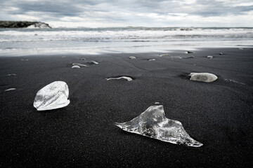 ice blocks on the black sand of Diamond Beach - 514414087