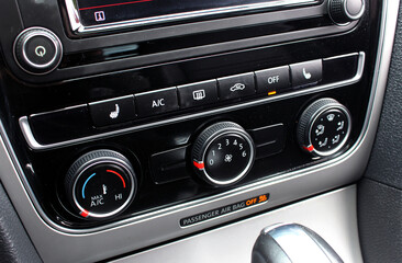 Air conditioner with power regulator. Car climate control. Automotive climate control. Modern Car air conditioner, interior of a new modern car.