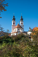 Fototapeta na wymiar idyllic baroque church, named Darstellung des Herrn, tourist resort Aschau, upper bavaria in autumn