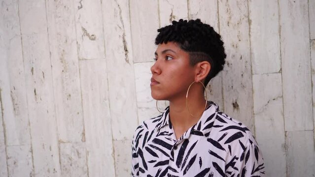 Quiet non-binary person in summer outdoors