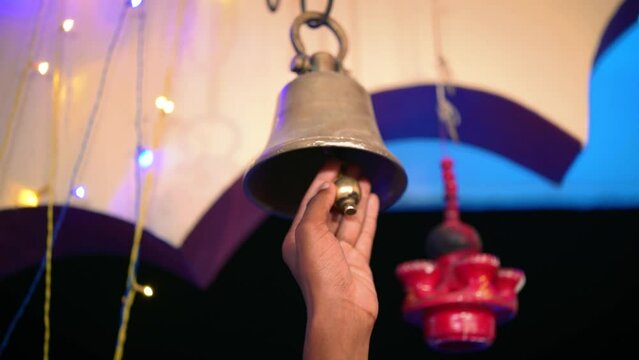 Hindu Temple Ringer Bell Closeup | Brass made bell is being rang by a person | Indian religious background 