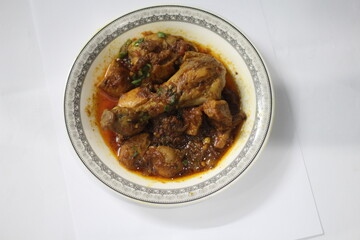 Chicken Karahi in white plate or dish in beautiful decoration photography