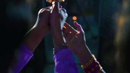 aarthi - traditional way of worshiping or praying god in hinduism, lit brass oil lamp, indian temple, religious background