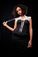 Lace and pearls: cool fashion. A confident stance from a sultry young female model. Part of a series of images with the same model.