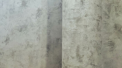 Gray concrete stone wall. Vintage rough cement wall. Faded gray stucco paint for modern interior design.
