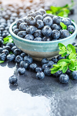 Fresh blueberries background with copy space for your text. Blueberry antioxidant organic superfood in a bowl concept for healthy eating and nutrition