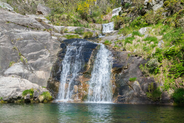 Fototapeta na wymiar View of a beautiful waterfall in a forest