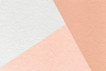 Texture of craft white and pink shade color paper background, macro. Structure of vintage rose abstract cardboard