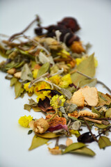 Mixed herbal tea, colorful, yellow and green on white background isolated