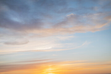 Naklejka na ściany i meble Blurred image of beautiful sunset with cloudy sky. Beauty in nature.