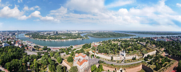 Aerial panorama of Belgrade, capital of Serbia,  with Kalemegdan park, mouth of the river Sava with Danube in the distance and Novi Beograd , aerial view  - obrazy, fototapety, plakaty