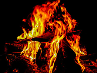 Flames emerging from the blazing woods.