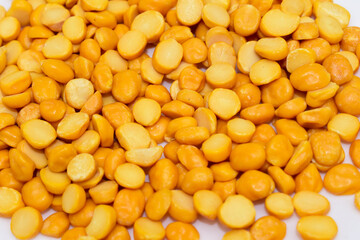 Close-up of Organic Gram (Cicer arietinum) or split yellow chana dal background.