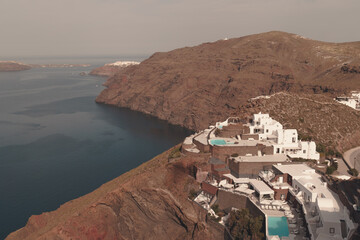 View from Imerovigli in Santorini Greece, May 2022. Retro style and colour graded image. View...
