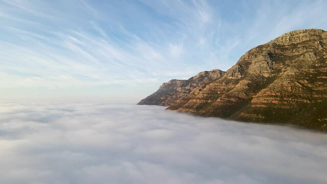 Aerial view of False bay covered in low cloud sunrise, Simonstown, Cape Town, South Africa.
