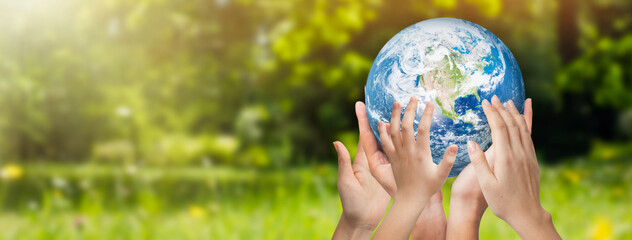 Hands raised to Earth. Environment protection