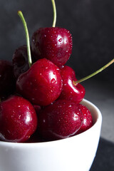 Red juicy sweet cherry in water drops close-up