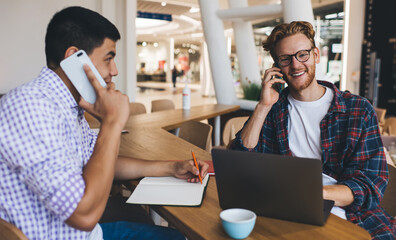 Multiracial business men working in office space