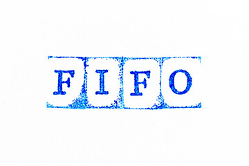 Obraz premium Blue color ink rubber stamp in word FIFO (Abbreviation of first in first out) on white paper background