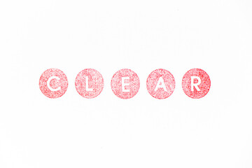 Red color rubber stamp in word clear on white paper background