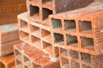 Pile of hollow bricks for constructing a building - close up