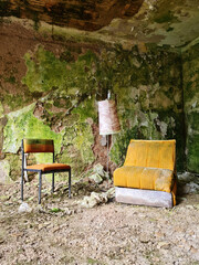 Glimpses of an old derelict industrial site with chair in foreground