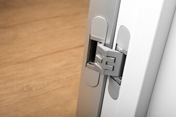 Modern aluminum door hinges on white doors, close-up. copy space, place for text - obrazy, fototapety, plakaty