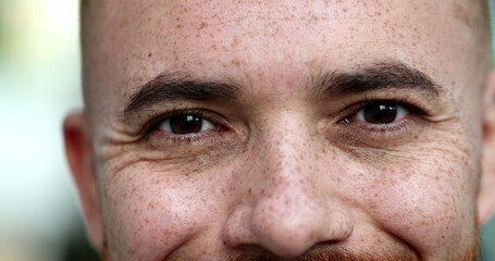 Contemplative young man closing eyes, taking a deep breath, feeling relaxed. close-up eyes portrait face