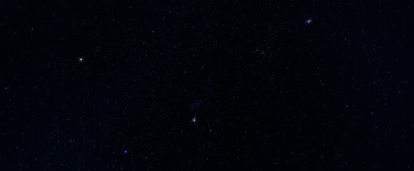 Stars in the sky.
Blue night panorama, milky way sky and stars on dark background, universe full of stars, nebula and galaxies.