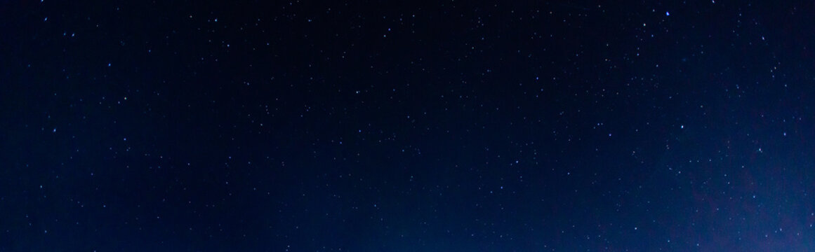 Panorama blue night sky milky way and star on dark background.Universe filled with stars, nebula and galaxy with noise and grain.Photo by long exposure and select white balance.selection focus.amazing